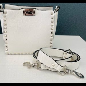 White leather purse with silver metal accents. Brand new, never used.